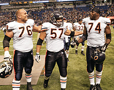 Chicago Bears center Olin Kreutz (57) and teammates Terrence