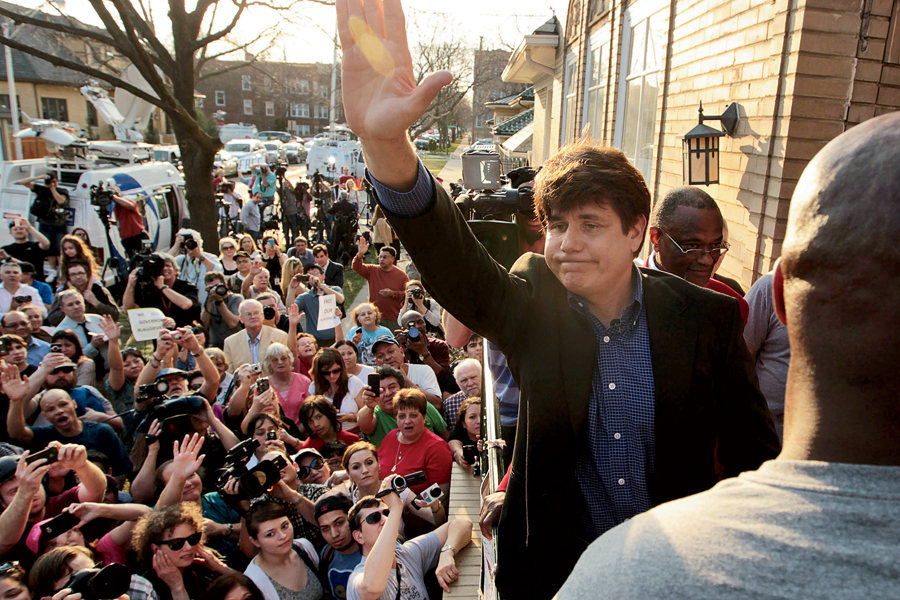 Blagojevich acknowledges supporters outside his home in March 2012.