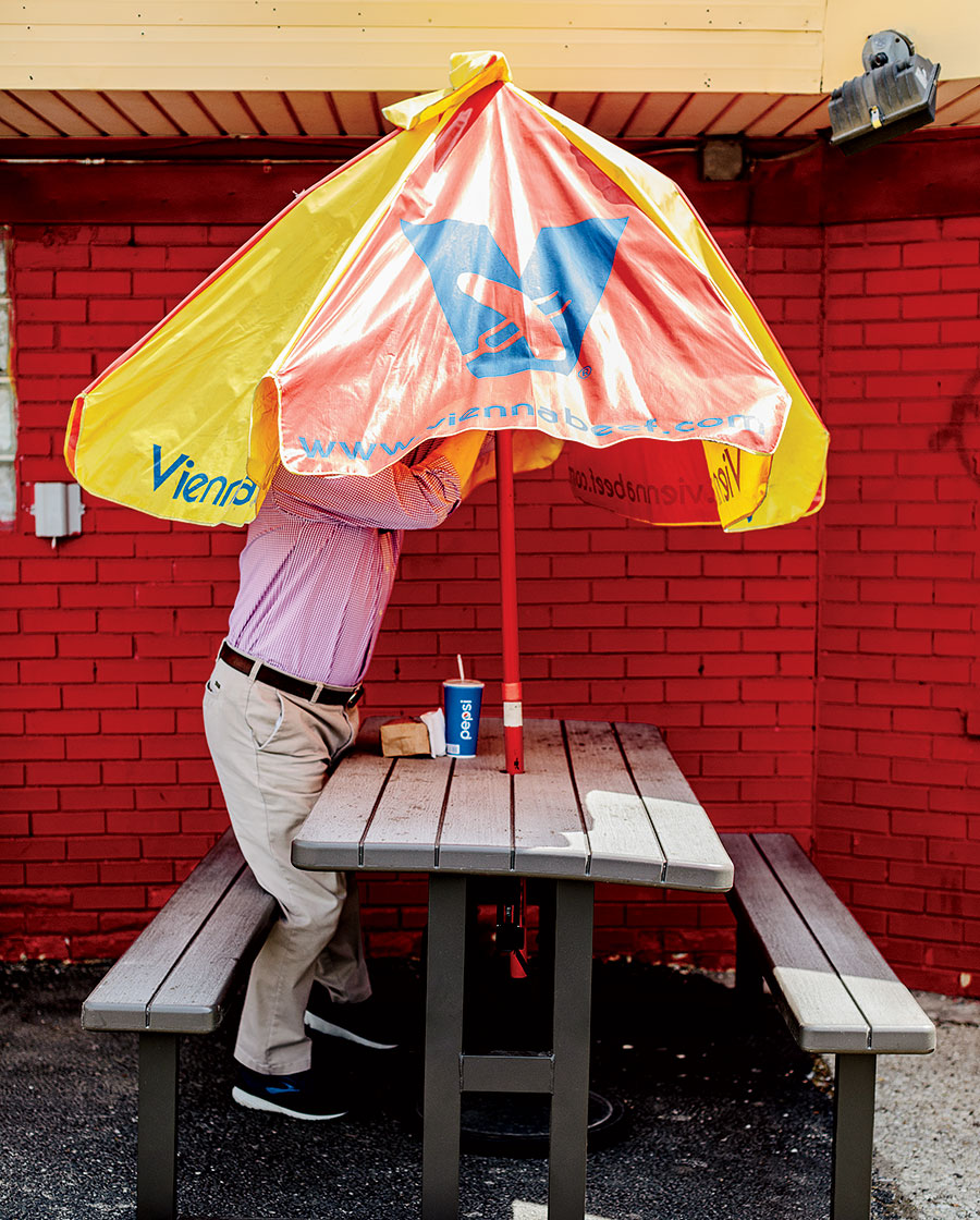 A hot dog stand umbrella
