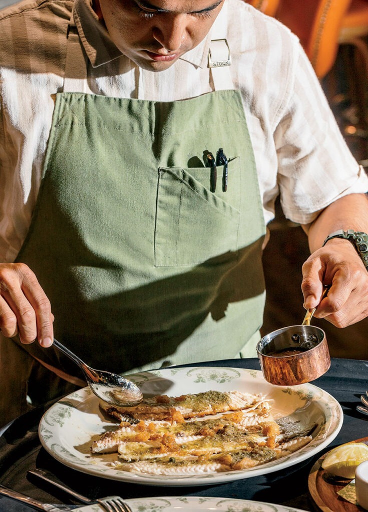 A chef preparing La Serre's Dover sole