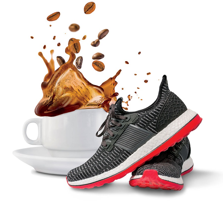 Athletic shoes and coffee splashing in a cup